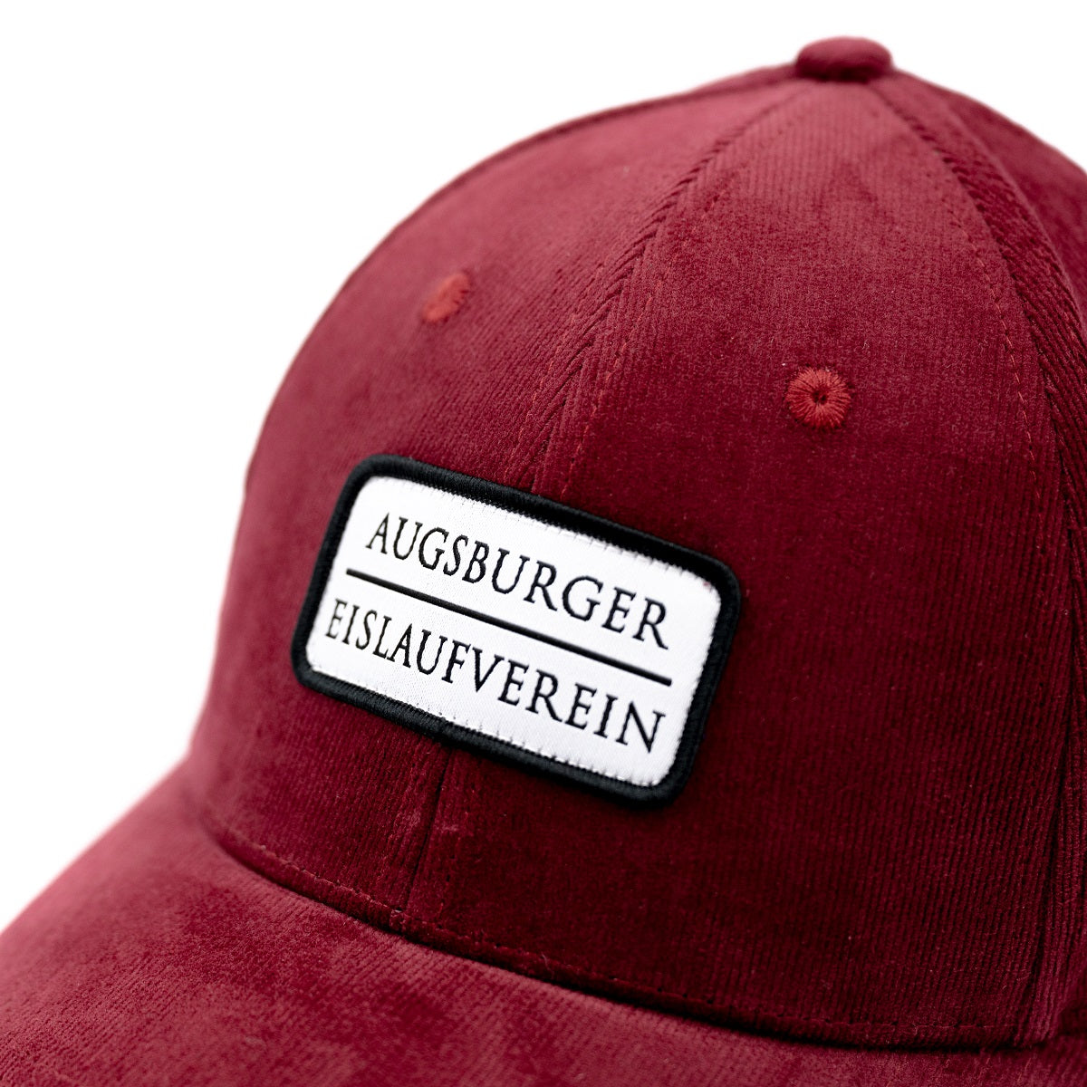 aufgenähter Badge "Augsburger Eislaufverein", bordeauxrote Cap in Cord-Optik